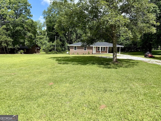 882 Campbell Rd, Covington, GA 30014 - view of grassy yard with driveway