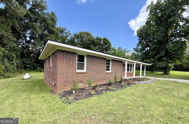 882 Campbell Rd, Covington, GA 30014 - view of front of property featuring crawl space, a front lawn, and brick siding
