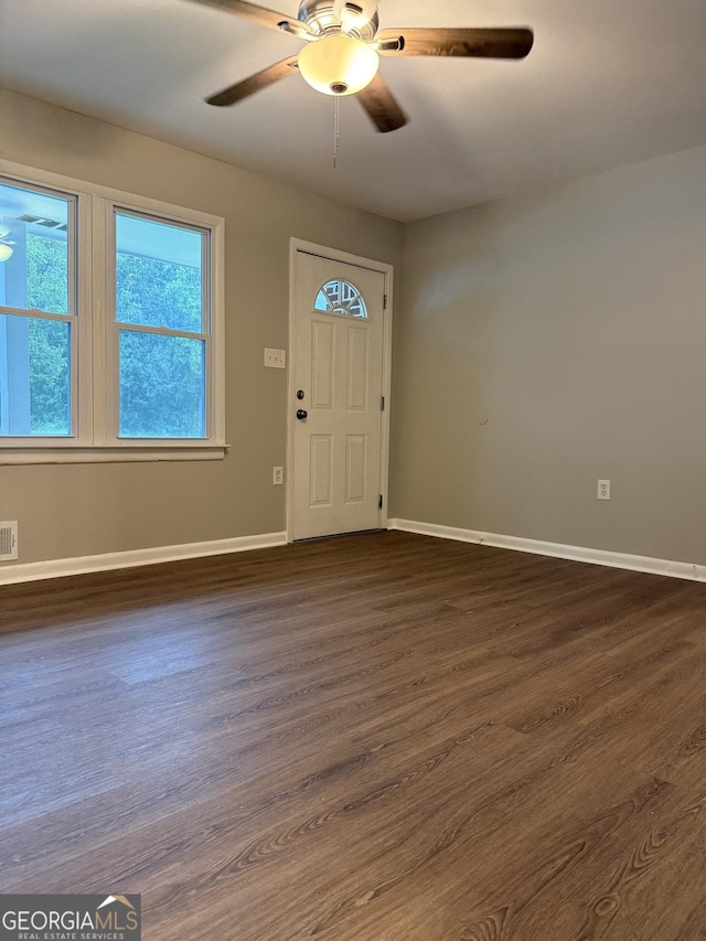 882 Campbell Rd, Covington, GA 30014 - foyer with healthy amount of natural light, ceiling fan, and dark wood-style flooring