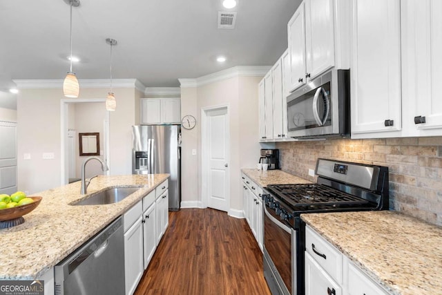 850 Ethereow Ct, Lawrenceville, GA 30046 - kitchen with appliances with stainless steel finishes, white cabinetry, light stone countertops, ornamental molding, and recessed lighting