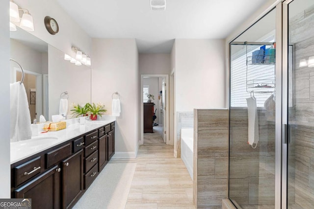 850 Ethereow Ct, Lawrenceville, GA 30046 - full bath featuring double vanity, a bath, and a tile shower