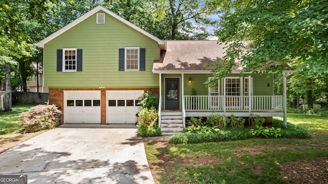 3627 Spring Meadow Ct, Acworth, GA 30101 - split level home with a porch, concrete driveway, a garage, brick siding, and roof with shingles