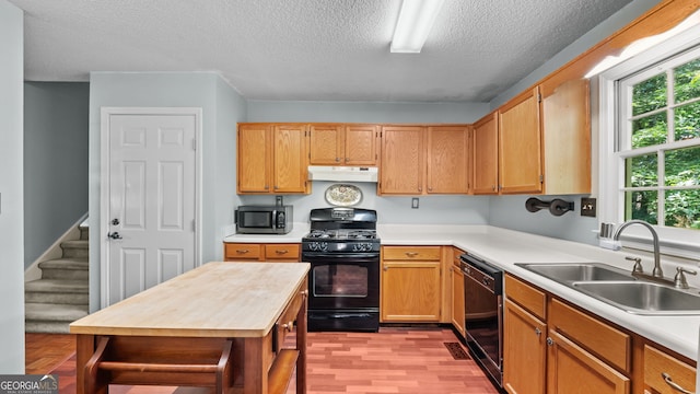 3627 Spring Meadow Ct, Acworth, GA 30101 - kitchen featuring under cabinet range hood, black appliances, a textured ceiling, and butcher block countertops