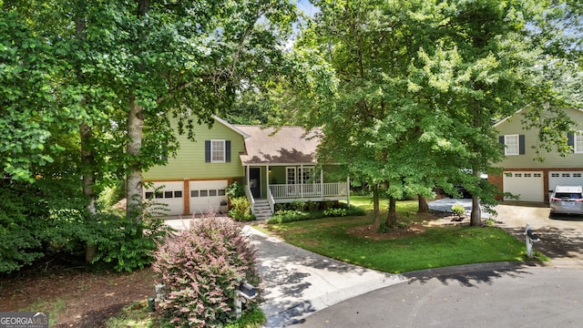 3627 Spring Meadow Ct, Acworth, GA 30101 - tri-level home with a garage, concrete driveway, and a porch