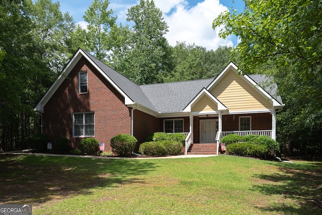 491 Brickleberry Rdg, Athens, GA 30605 - view of front of home featuring brick siding, a front yard, a porch, and roof with shingles