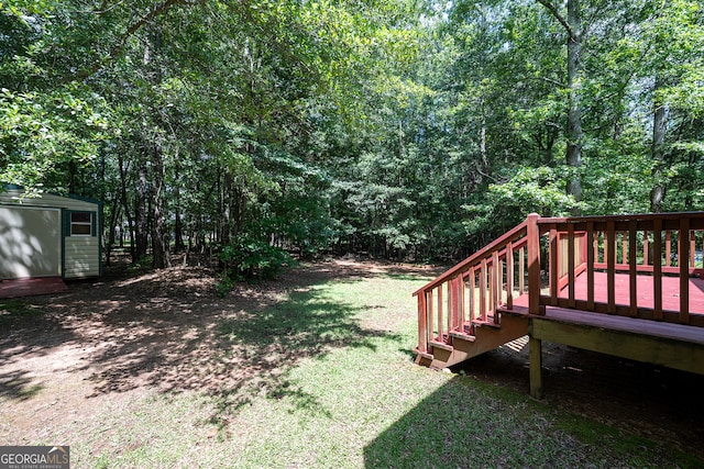 491 Brickleberry Rdg, Athens, GA 30605 - view of grassy yard with a storage unit and a deck