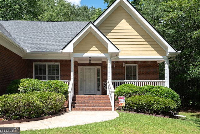 491 Brickleberry Rdg, Athens, GA 30605 - view of front of property featuring brick siding, roof with shingles, and a porch