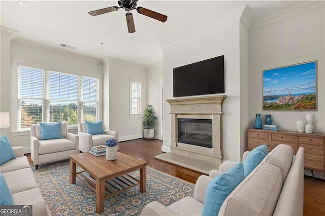 3635 E Paces Cir NE Unit 1405, Atlanta, GA 30326 - living room featuring ornamental molding, healthy amount of natural light, ceiling fan, wood finished floors, and a glass covered fireplace