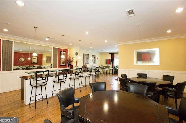 3635 E Paces Cir NE Unit 1405, Atlanta, GA 30326 - dining room featuring ornamental molding, light wood finished floors, wainscoting, and recessed lighting