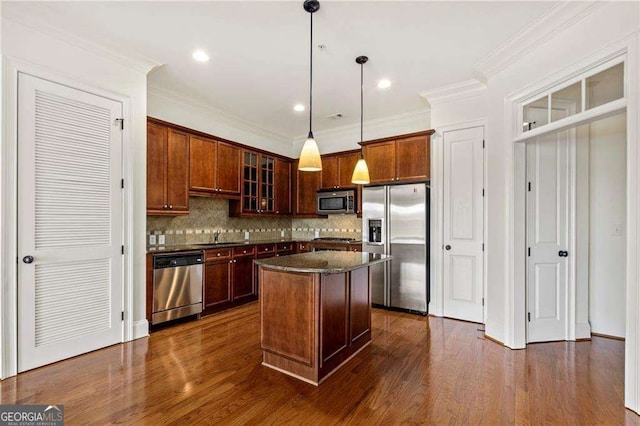 3635 E Paces Cir NE Unit 1405, Atlanta, GA 30326 - kitchen with stainless steel appliances, tasteful backsplash, glass insert cabinets, a center island, and decorative light fixtures