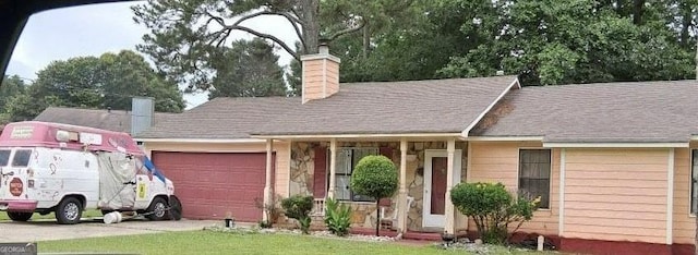 10359 Briarbay Loop, Jonesboro, GA 30238 - view of front of property featuring a chimney, a garage, and driveway
