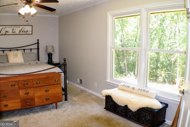 1310 Larkview Dr SW, Lilburn, GA 30047 - bedroom featuring multiple windows, light carpet, crown molding, and a ceiling fan
