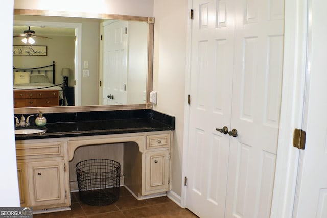 1310 Larkview Dr SW, Lilburn, GA 30047 - bathroom featuring vanity, tile patterned floors, and a ceiling fan