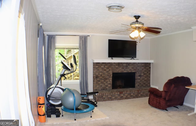 1310 Larkview Dr SW, Lilburn, GA 30047 - exercise area with a ceiling fan, ornamental molding, a brick fireplace, carpet flooring, and a textured ceiling