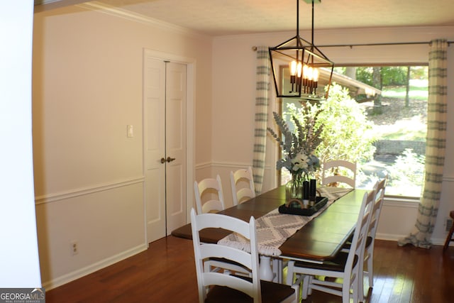 1310 Larkview Dr SW, Lilburn, GA 30047 - dining space featuring a chandelier, wood-type flooring, healthy amount of natural light, and crown molding