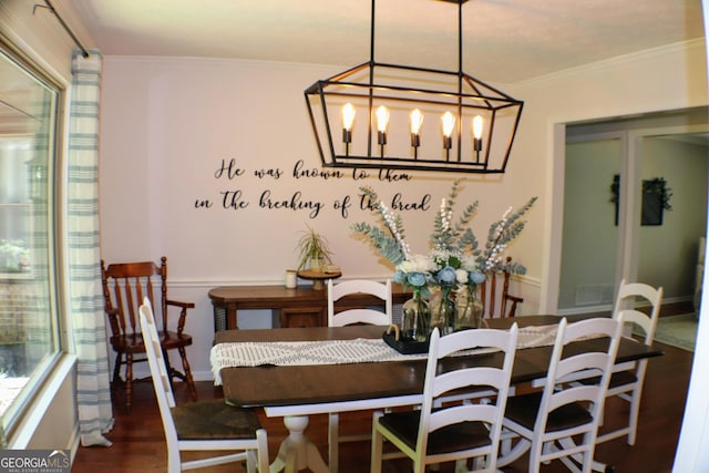 1310 Larkview Dr SW, Lilburn, GA 30047 - dining space featuring wood finished floors, a chandelier, and ornamental molding