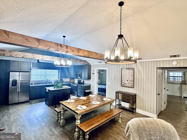 226 Cherokee Rd, Glenwood, GA 30428 - dining space featuring a chandelier, dark wood-type flooring, vaulted ceiling, and a textured ceiling