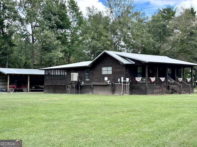 226 Cherokee Rd, Glenwood, GA 30428 - view of front of home featuring a front lawn, a carport, and a porch