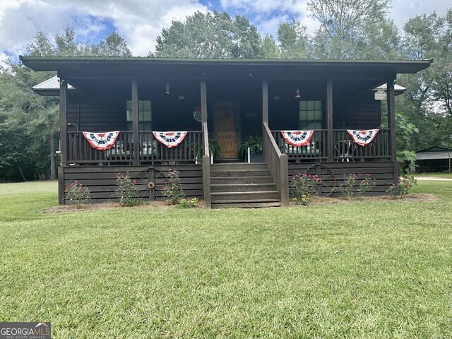 226 Cherokee Rd, Glenwood, GA 30428 - view of front of home featuring covered porch and a front lawn