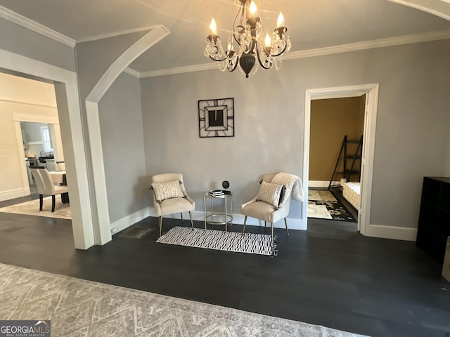 1012 Institute St NW, Conyers, GA 30012 - sitting room featuring arched walkways, wood finished floors, ornamental molding, and a chandelier