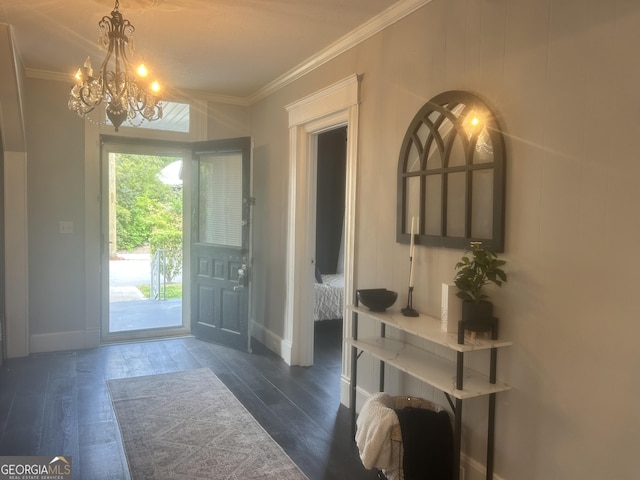 1012 Institute St NW, Conyers, GA 30012 - foyer entrance featuring a chandelier, crown molding, and dark wood-style flooring