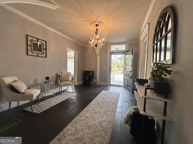 1012 Institute St NW, Conyers, GA 30012 - living room with a chandelier, dark wood-style floors, and crown molding