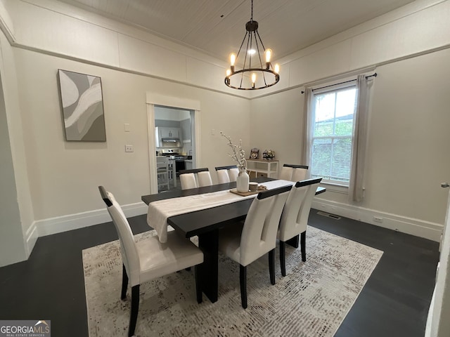 1012 Institute St NW, Conyers, GA 30012 - dining space with a chandelier and dark wood-type flooring