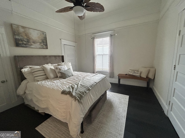 1012 Institute St NW, Conyers, GA 30012 - bedroom with crown molding, dark wood-style flooring, and ceiling fan