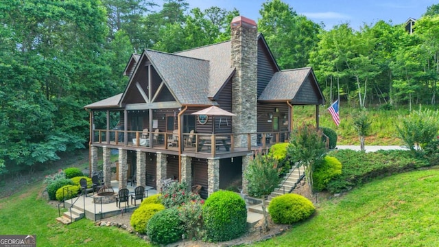 2357 Haven Heights Rd, Hiawassee, GA 30546 - back of house featuring a patio area, stairway, a wooden deck, a lawn, and roof with shingles