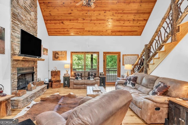 2357 Haven Heights Rd, Hiawassee, GA 30546 - living area featuring wood finished floors, high vaulted ceiling, a fireplace, wood ceiling, and stairway