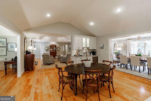 1060 Woodhollow Ln, Athens, GA 30606 - dining space featuring vaulted ceiling, light wood finished floors, recessed lighting, and a chandelier
