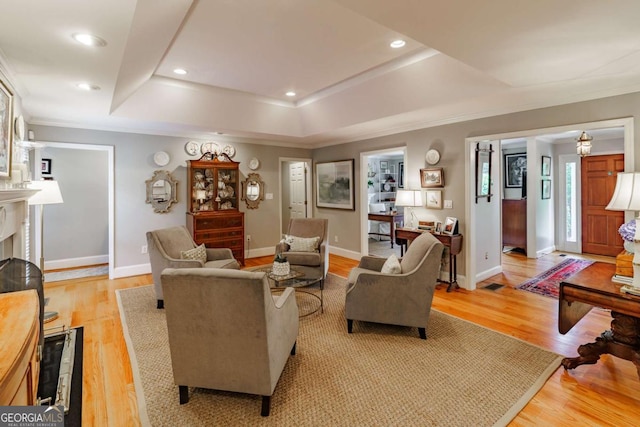 1060 Woodhollow Ln, Athens, GA 30606 - living room with a raised ceiling, crown molding, light wood-style flooring, healthy amount of natural light, and recessed lighting