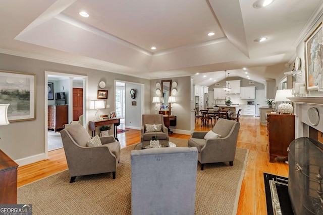 1060 Woodhollow Ln, Athens, GA 30606 - living room featuring a tray ceiling, light wood-type flooring, recessed lighting, and crown molding