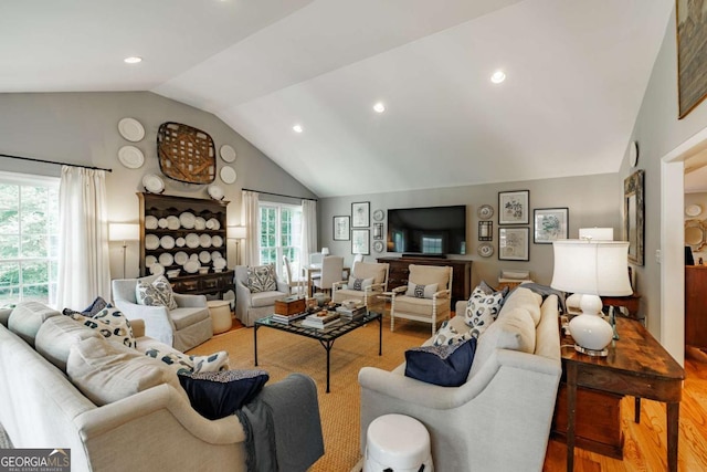 1060 Woodhollow Ln, Athens, GA 30606 - living room featuring vaulted ceiling, wood finished floors, and recessed lighting