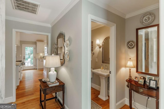 1060 Woodhollow Ln, Athens, GA 30606 - hall with light wood finished floors and crown molding