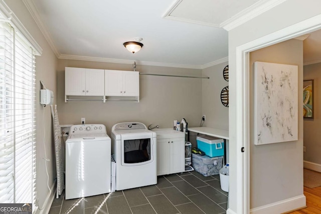 1060 Woodhollow Ln, Athens, GA 30606 - laundry area featuring cabinet space, washing machine and dryer, crown molding, and dark tile patterned flooring