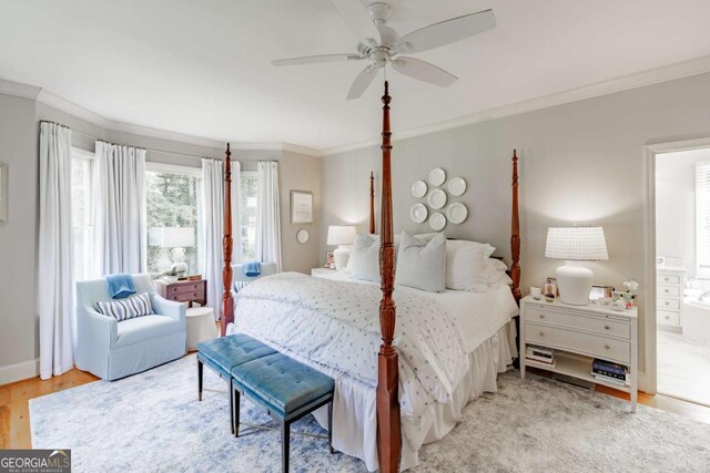 1060 Woodhollow Ln, Athens, GA 30606 - bedroom featuring crown molding, wood finished floors, ensuite bathroom, and a ceiling fan