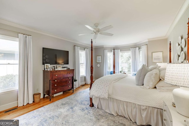 1060 Woodhollow Ln, Athens, GA 30606 - bedroom with crown molding, wood finished floors, and ceiling fan