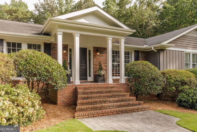 1060 Woodhollow Ln, Athens, GA 30606 - entrance to property with covered porch, board and batten siding, and brick siding