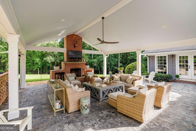 1060 Woodhollow Ln, Athens, GA 30606 - view of patio / terrace featuring french doors, an outdoor living space with a fireplace, and a ceiling fan