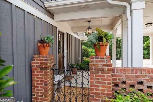 1060 Woodhollow Ln, Athens, GA 30606 - property entrance featuring covered porch and board and batten siding