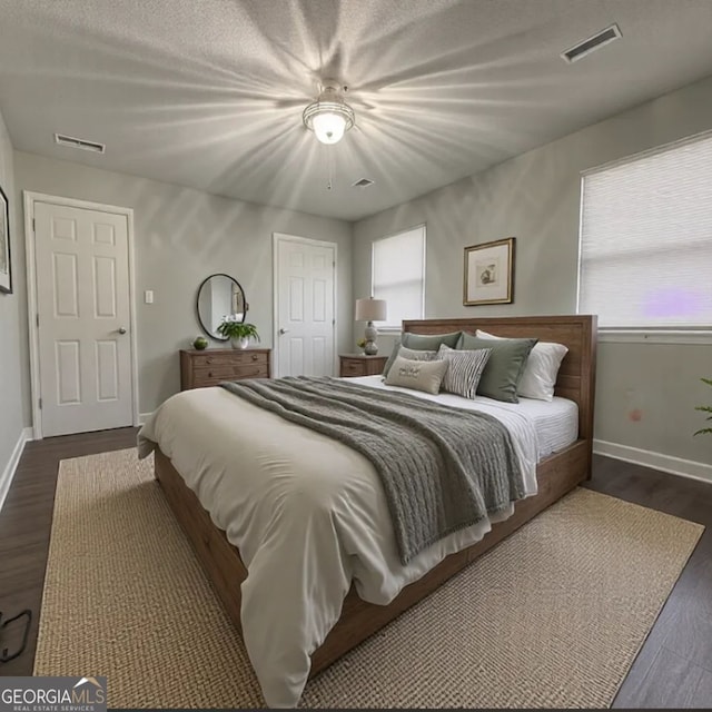 303 Latimer St, Marietta, GA 30008 - bedroom with multiple windows and dark wood-style floors