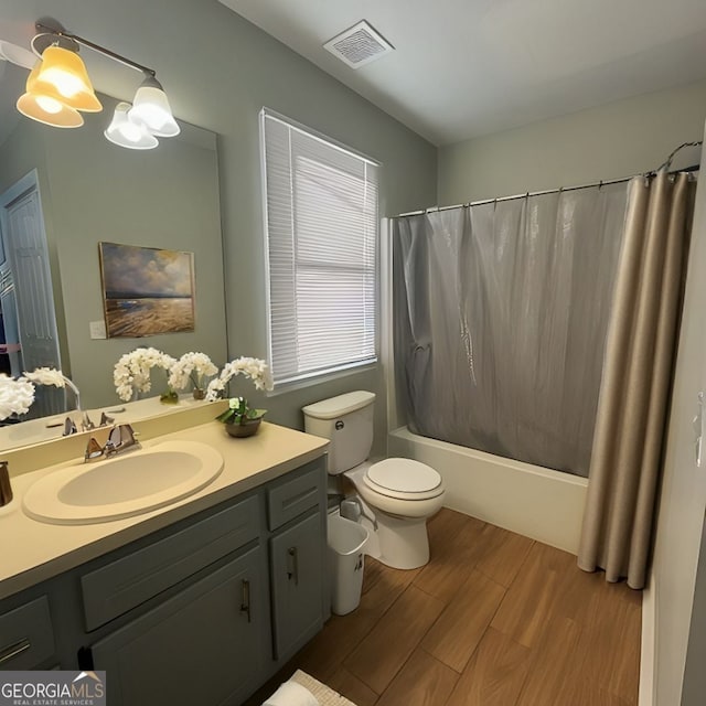 303 Latimer St, Marietta, GA 30008 - bathroom featuring vanity, shower / bath combination with curtain, and wood finished floors