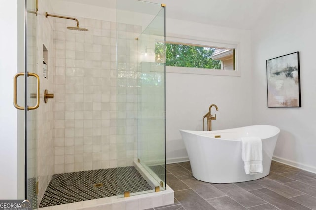 5007 Highland Oaks Ct SE, Smyrna, GA 30126 - full bath with a shower stall, a freestanding tub, and tile patterned flooring