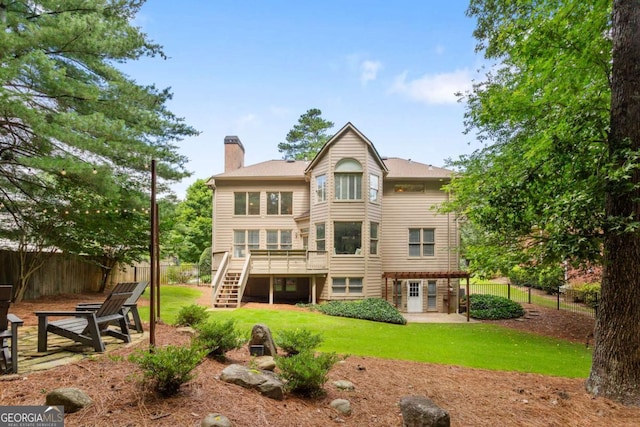 5007 Highland Oaks Ct SE, Smyrna, GA 30126 - back of property with a chimney, stairway, a deck, and a patio area