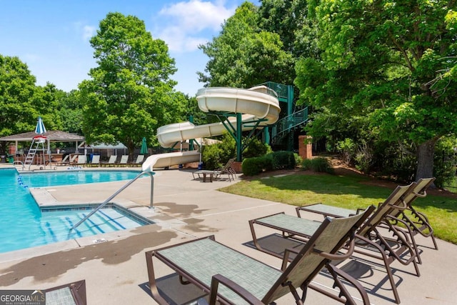 5007 Highland Oaks Ct SE, Smyrna, GA 30126 - community pool featuring a water slide, a gazebo, a patio, a lawn, and view of scattered trees