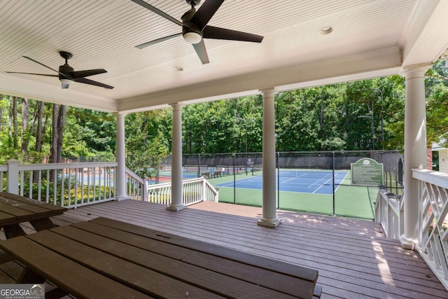5007 Highland Oaks Ct SE, Smyrna, GA 30126 - wooden deck featuring a tennis court, ceiling fan, and view of scattered trees