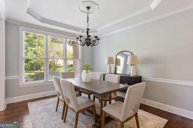 5007 Highland Oaks Ct SE, Smyrna, GA 30126 - dining area with a chandelier, a raised ceiling, wood finished floors, and crown molding