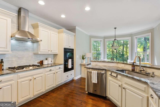 5007 Highland Oaks Ct SE, Smyrna, GA 30126 - kitchen with stainless steel dishwasher, wall chimney exhaust hood, backsplash, gas cooktop, and recessed lighting