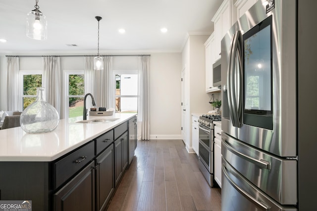 550 Azalea Xing, Dallas, GA 30132 - kitchen featuring appliances with stainless steel finishes, white cabinetry, light countertops, ornamental molding, and dark wood-style flooring